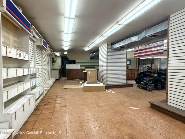 a view of livingroom with furniture and a window