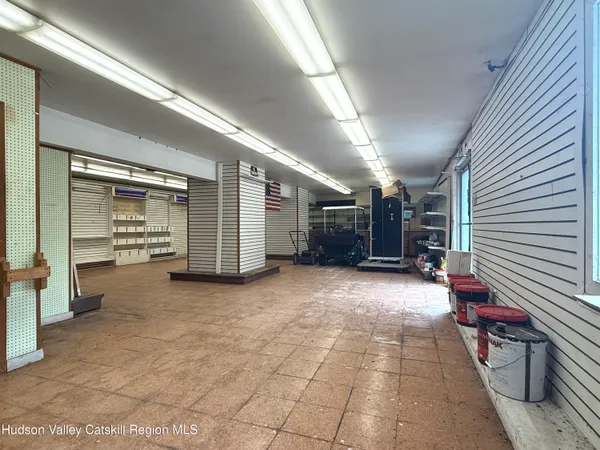 a view of empty room with wooden walls