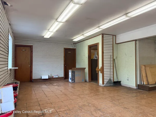 an empty room with furniture and a window
