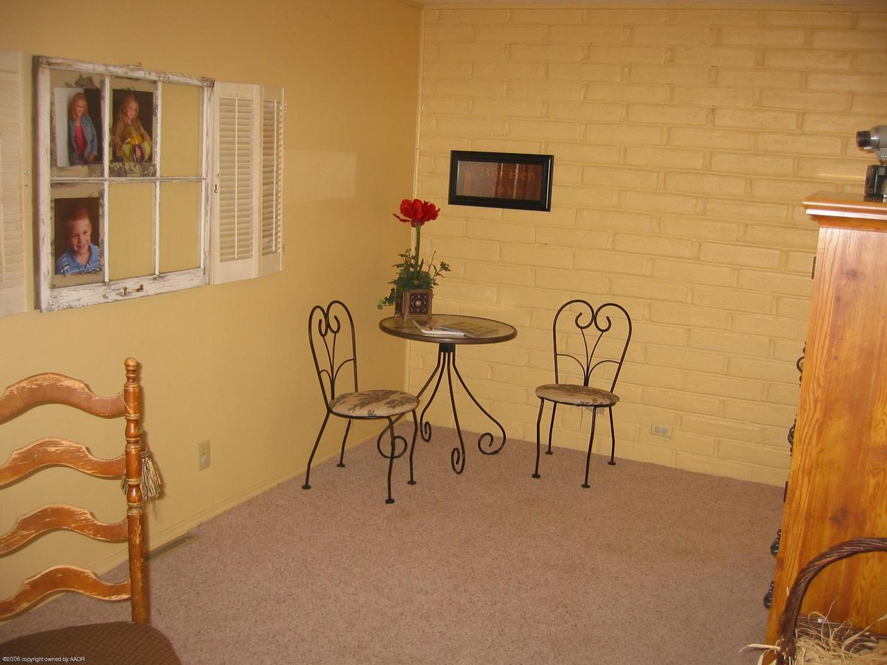 7904 Goodnight Trail Amarillo, TX 79110 - Photo 8 of 13 a view of a workspace with furniture