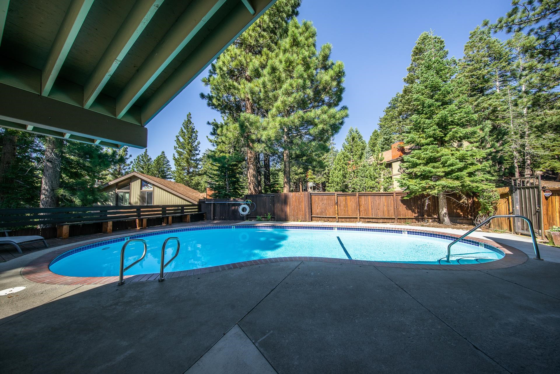153 Lake Mary Road, Unit 132 Mammoth Lakes, CA 93546 - Photo 21 of 32 View of pool featuring a patio area and a fenced backyard