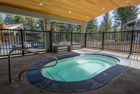 a view of a swimming pool with a patio