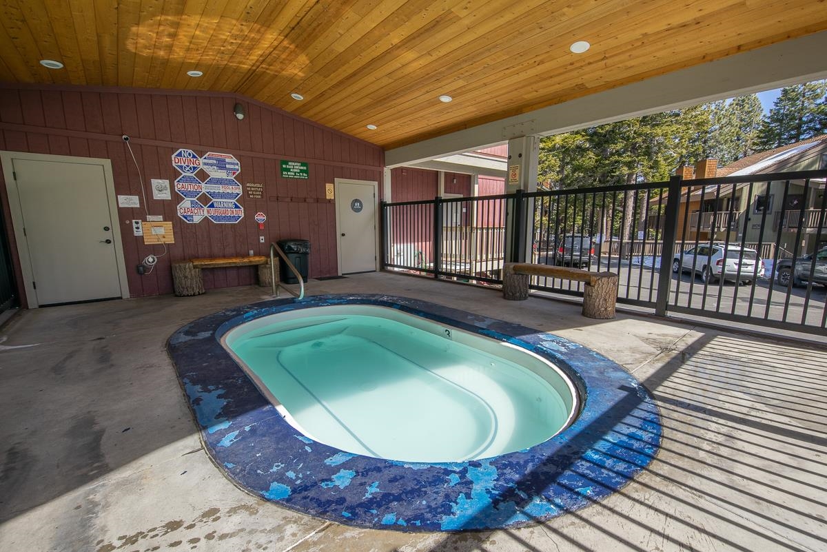 153 Lake Mary Road, Unit 132 Mammoth Lakes, CA 93546 - Photo 24 of 32 View of swimming pool with a hot tub and a patio
