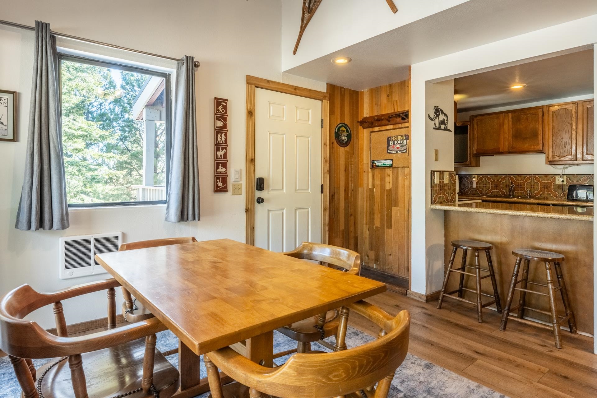 153 Lake Mary Road, Unit 132 Mammoth Lakes, CA 93546 - Photo 5 of 20 Dining space with wood finished floors and wood walls