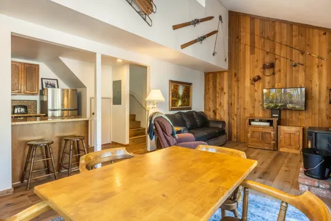 a swimming pool with a couch and wooden floor