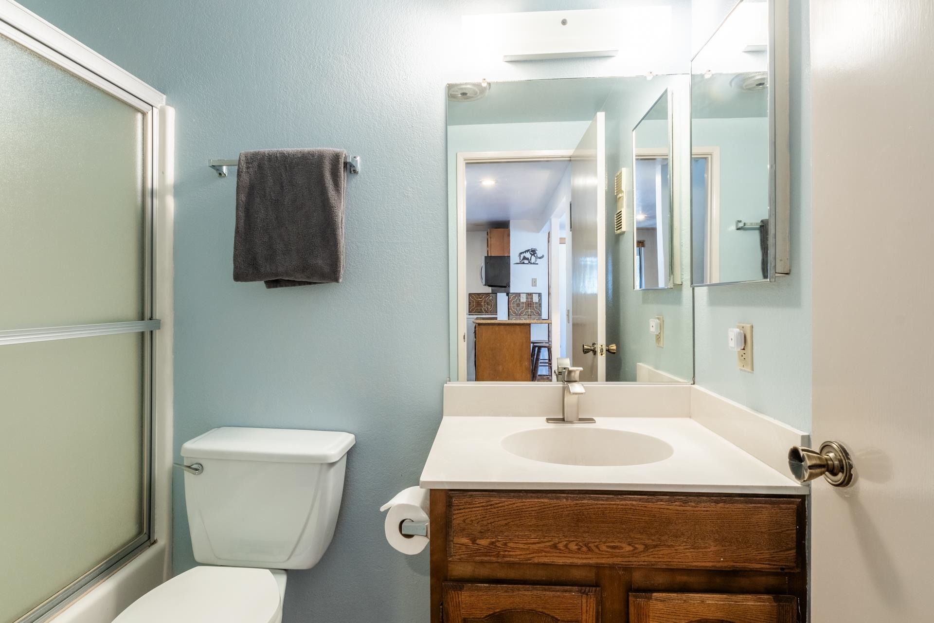 153 Lake Mary Road, Unit 132 Mammoth Lakes, CA 93546 - Photo 9 of 20 Full bath with vanity, bath / shower combo with glass door, and a textured wall