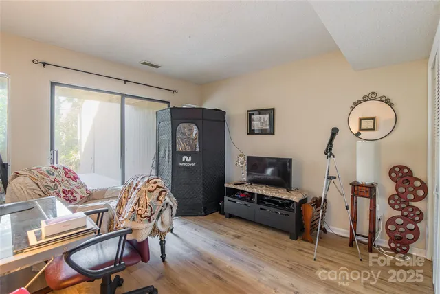an aerial view of a house with outdoor space and lake view