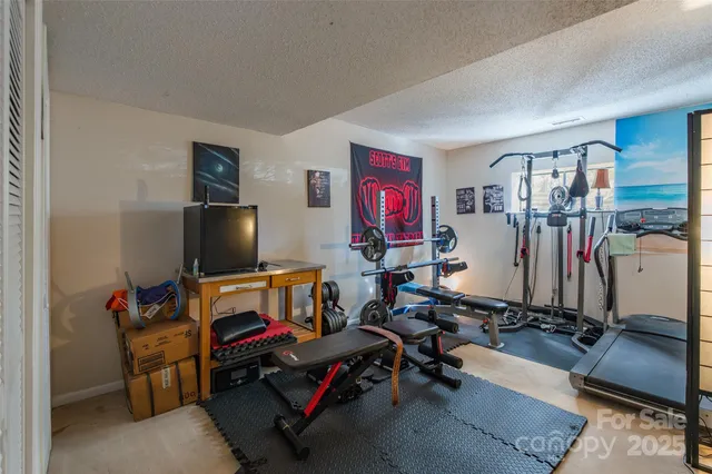 a view of a swimming pool with a patio and a garden