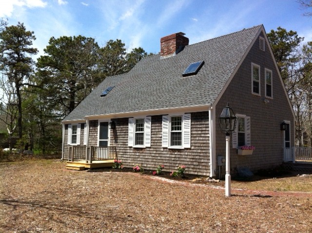 59 Marthas Road Edgartown, MA 02539 - Photo 1 of 17 a house with trees in front of it