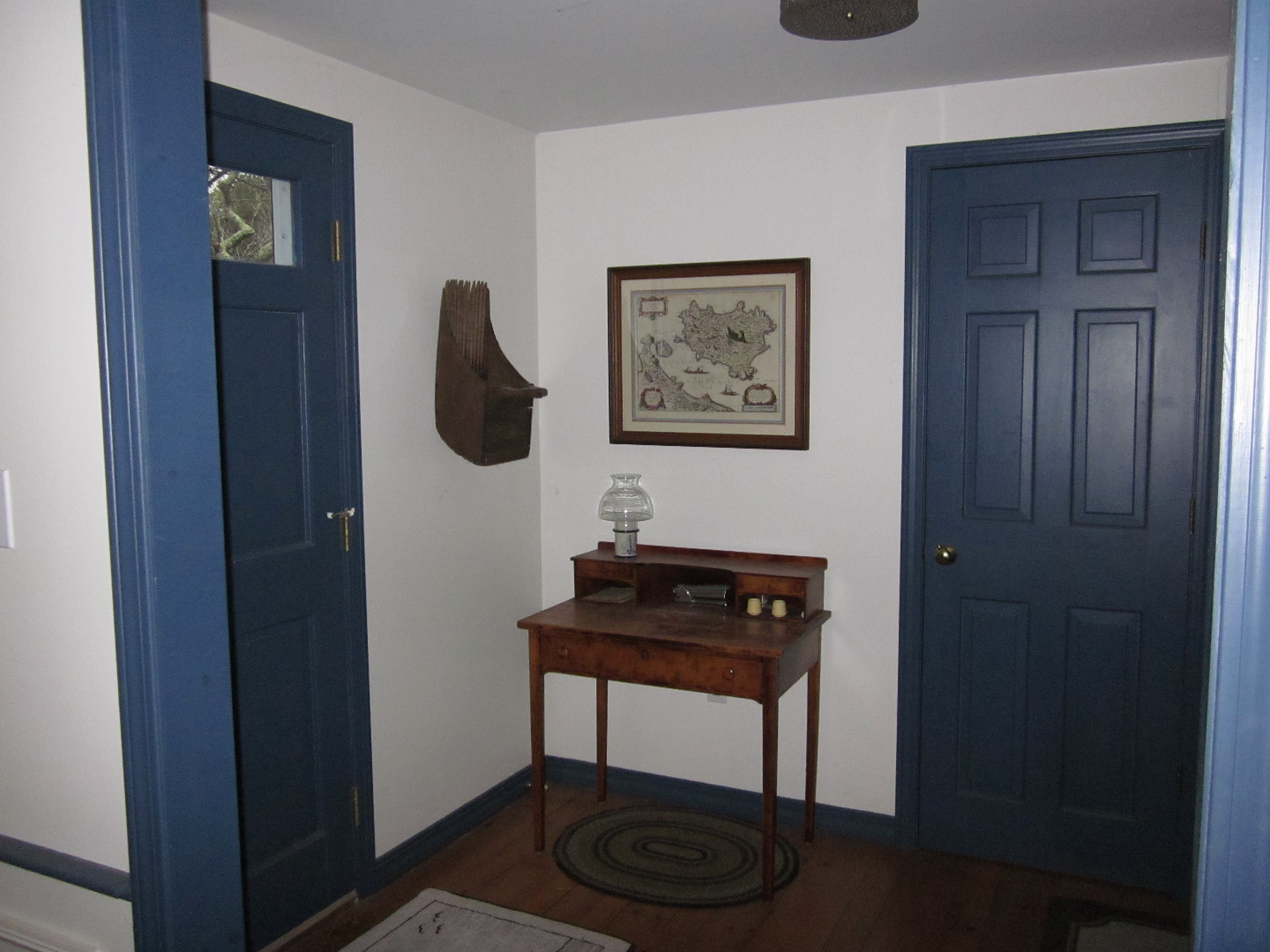 59 Marthas Road Edgartown, MA 02539 - Photo 11 of 17 a table and chair in a room next to a window