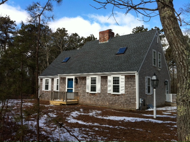 59 Marthas Road Edgartown, MA 02539 - Photo 3 of 17 a front view of a house with a yard