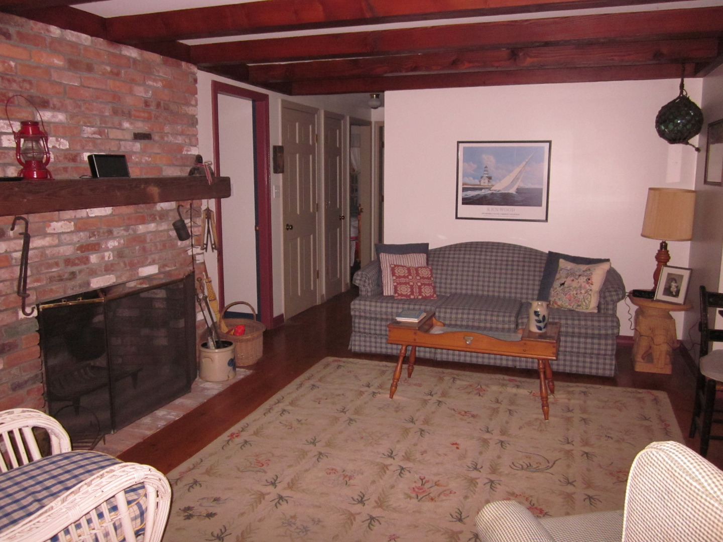 59 Marthas Road Edgartown, MA 02539 - Photo 5 of 17 a living room with furniture and a fireplace