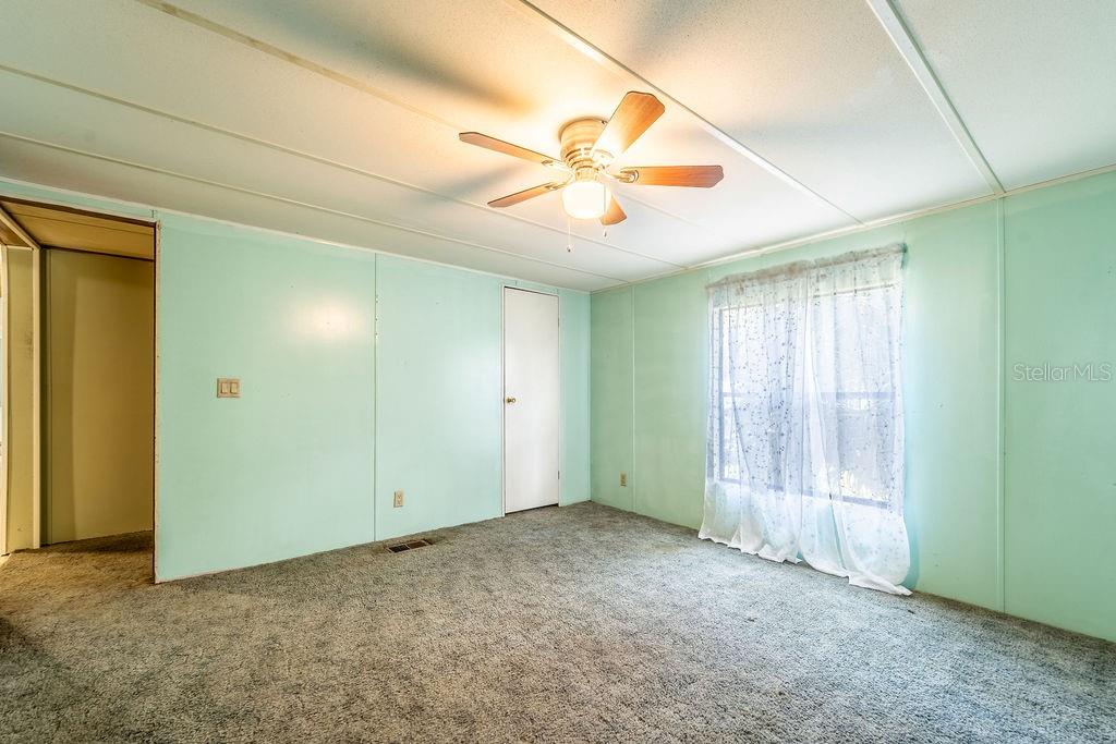24031 Armadillo Road Astor, FL 32102 - Photo 36 of 43 a view of an empty room with a window