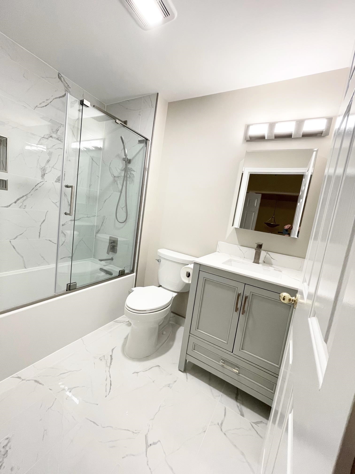 24 Bergen Ridge Road, Unit 1 North Bergen, NJ 07047 - Photo 13 of 17 a bathroom with a sink a toilet and shower