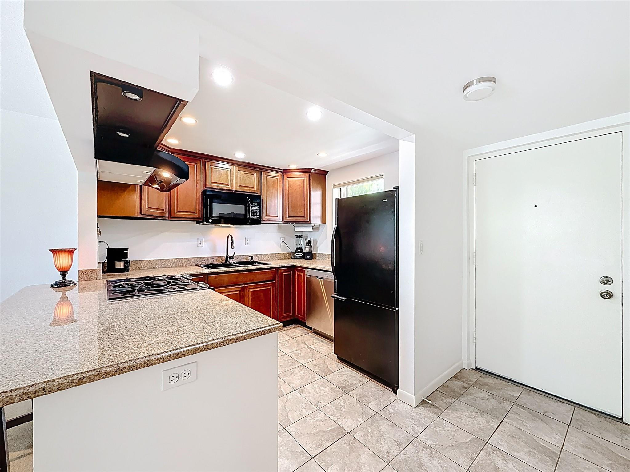 13020 Southwest 92nd Avenue, Unit A309 Miami, FL 33176 - Photo 4 of 28 Entry and Kitchen
