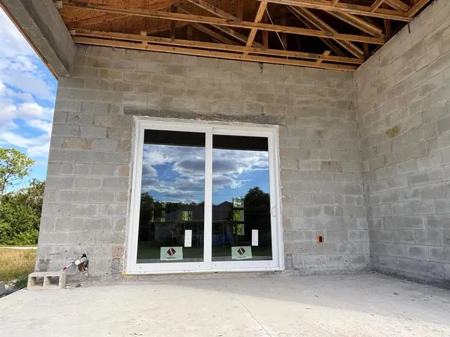 a view of a brick house with outdoor space