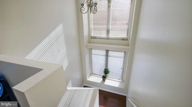 a view of an entryway with wooden floor
