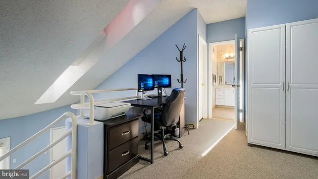 a view of a hallway with workspace