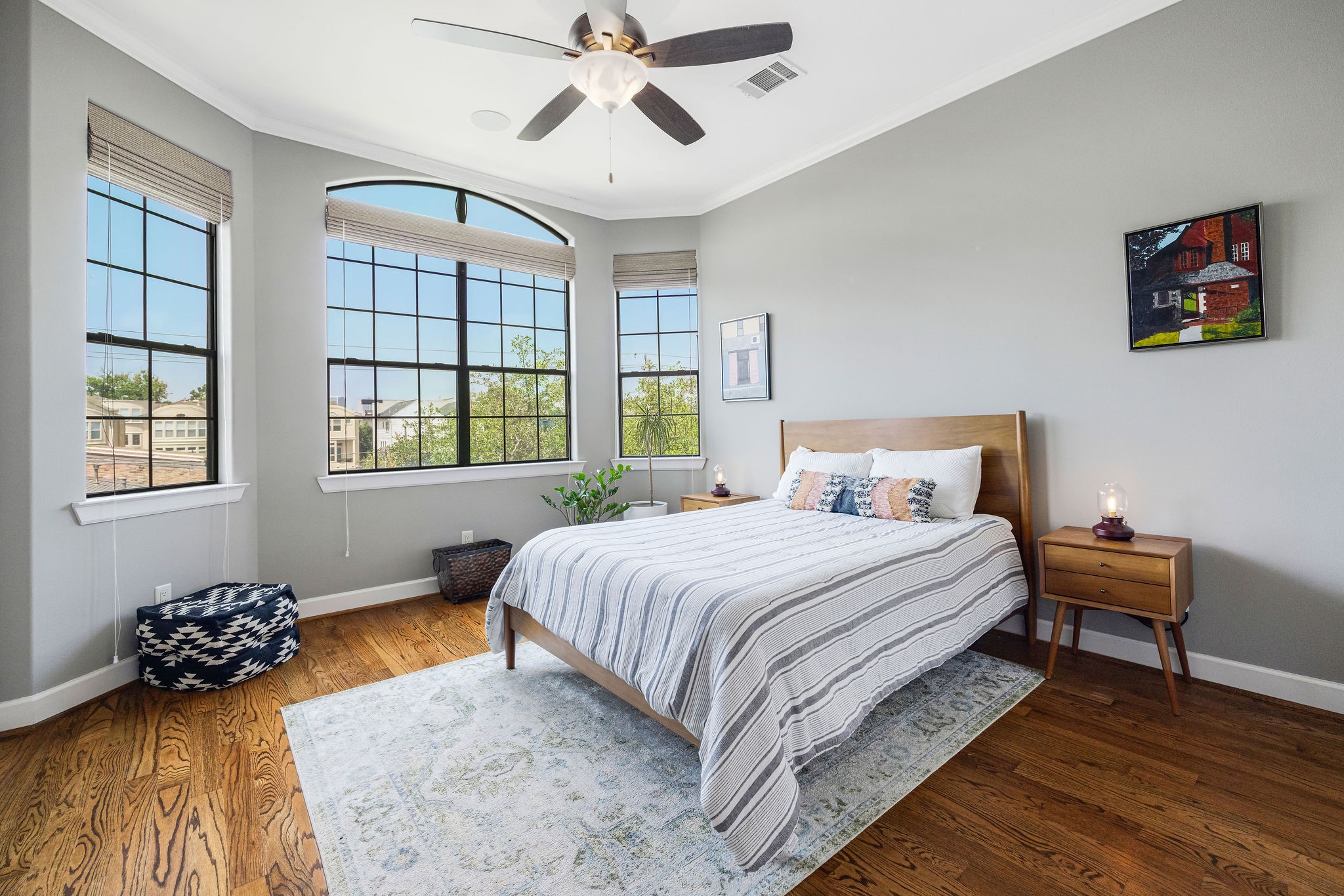 2415 Commonwealth Street Houston, TX 77006 - Photo 19 of 26 Designed with comfort in mind, the spacious third-floor secondary bedroom features abundant natural light, generous storage, and ample room for guests or everyday living.