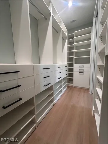 a view of an empty walk in closet