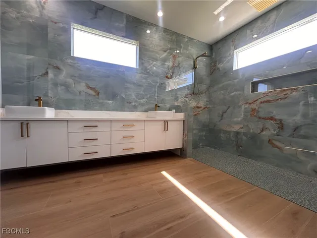 a bathroom with a bathtub and a sink