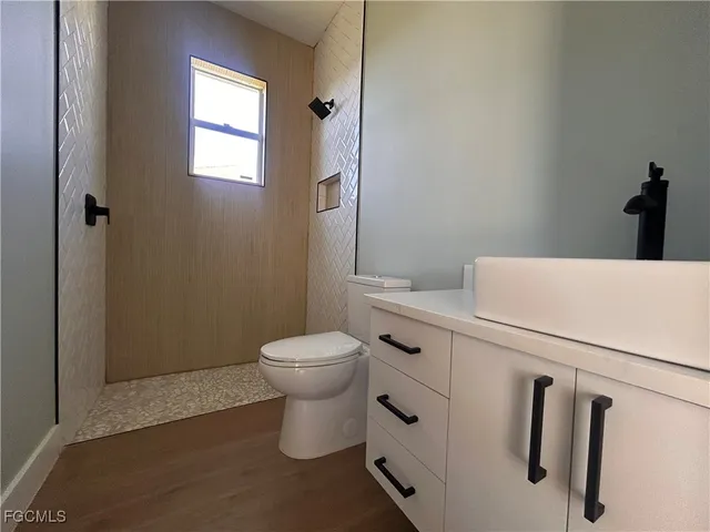a bathroom with a toilet and a sink