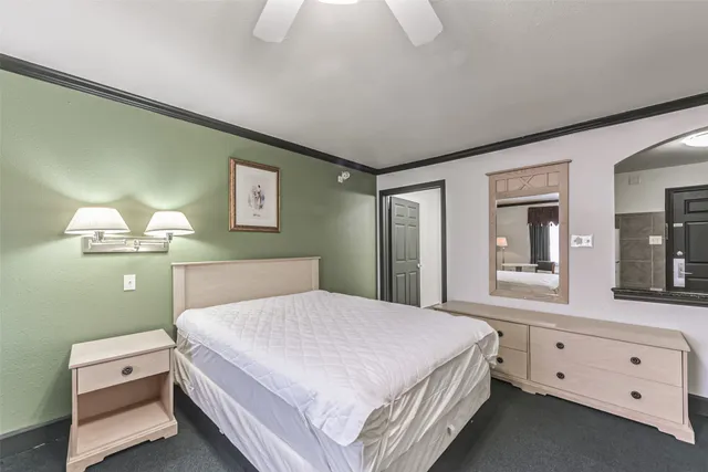 a bathroom with a double vanity sink toilet mirror and shower