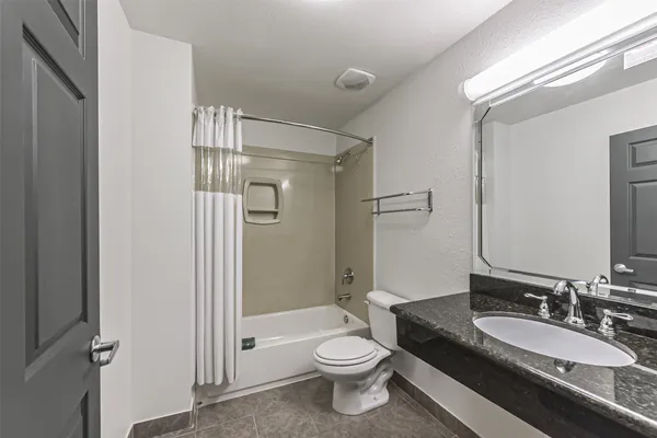 a view of a workspace with furniture