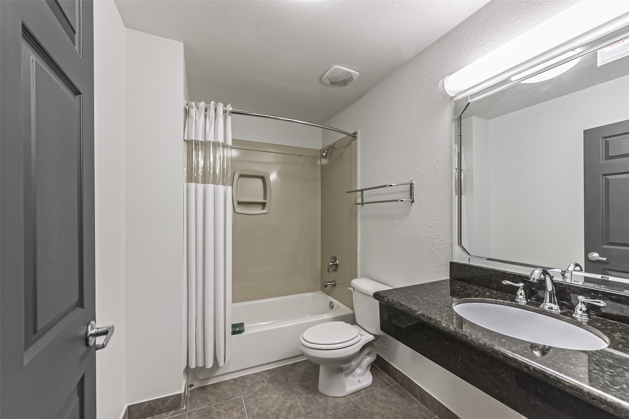 1025 Swanson Street, Unit 314 Houston, TX 77030 - Photo 16 of 25 a bathroom with a double vanity sink toilet mirror and shower