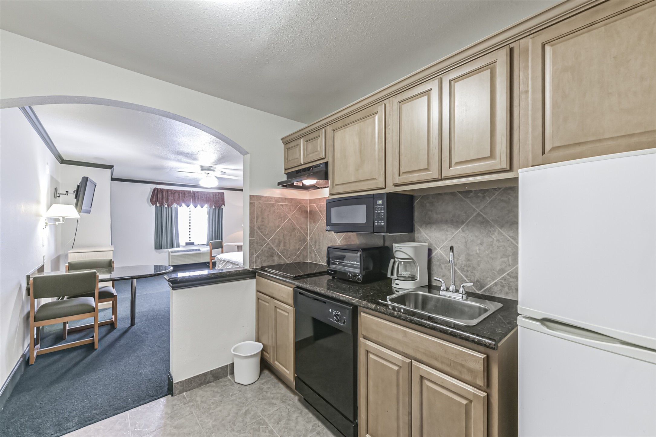 1025 Swanson Street, Unit 314 Houston, TX 77030 - Photo 22 of 25 a kitchen with stainless steel appliances granite countertop a sink stove and cabinets
