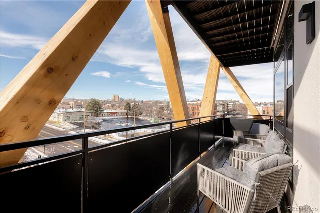 a view of balcony with furniture