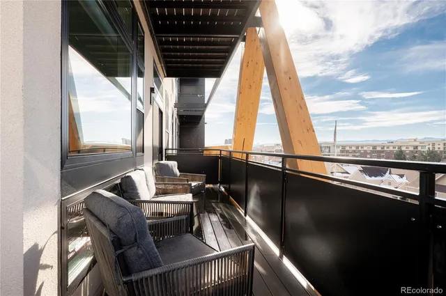 a view of balcony with furniture