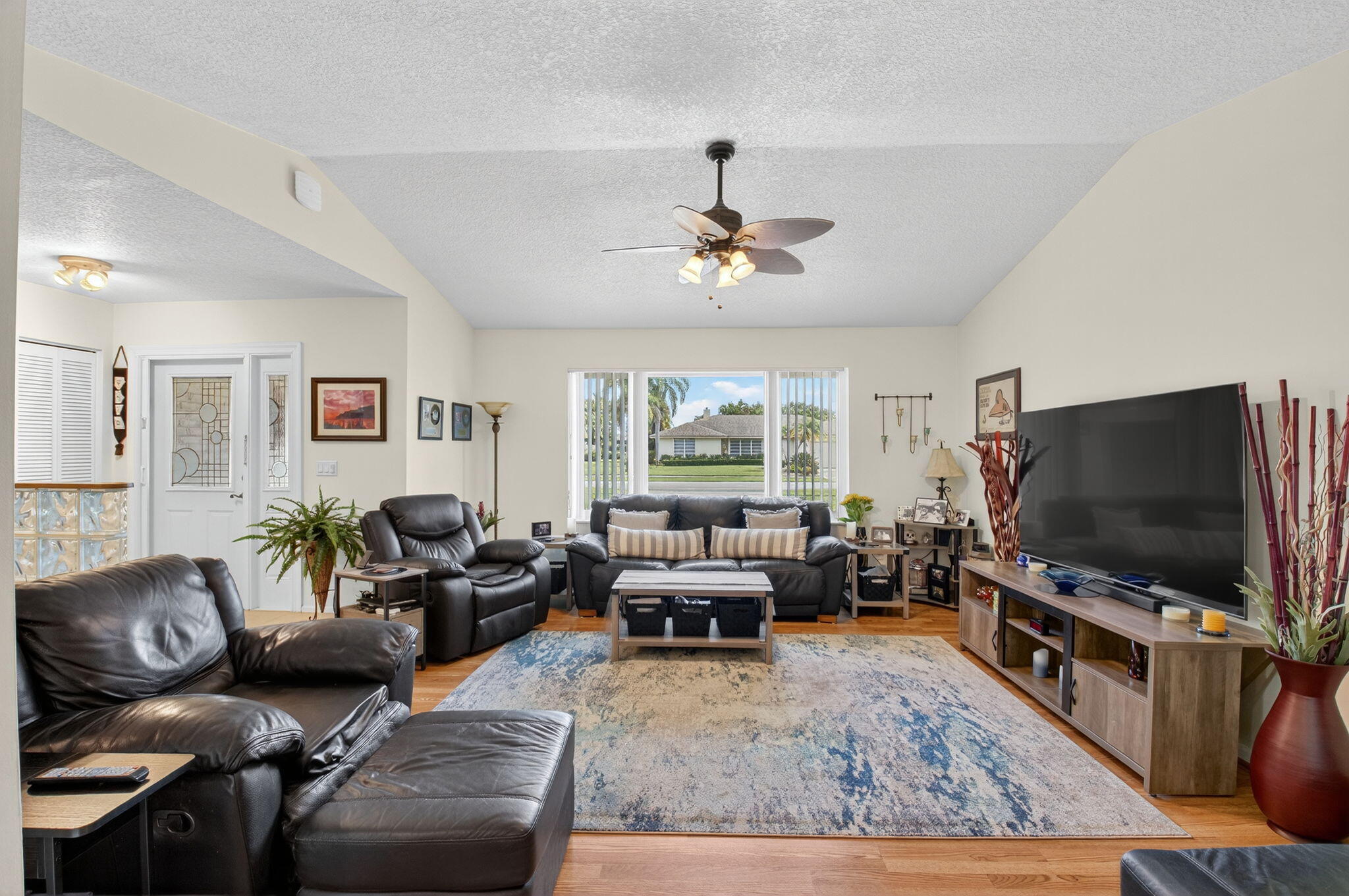 17705 Maplewood Drive Boca Raton, FL 33487 - Photo 13 of 71 a living room with furniture and a flat screen tv