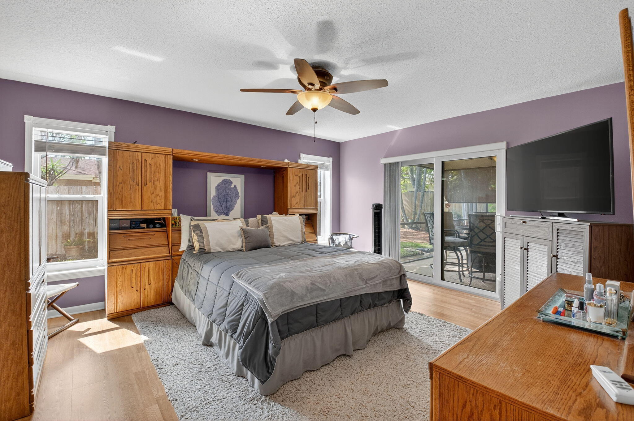 17705 Maplewood Drive Boca Raton, FL 33487 - Photo 30 of 71 a bedroom with a bed and glass walk in closet