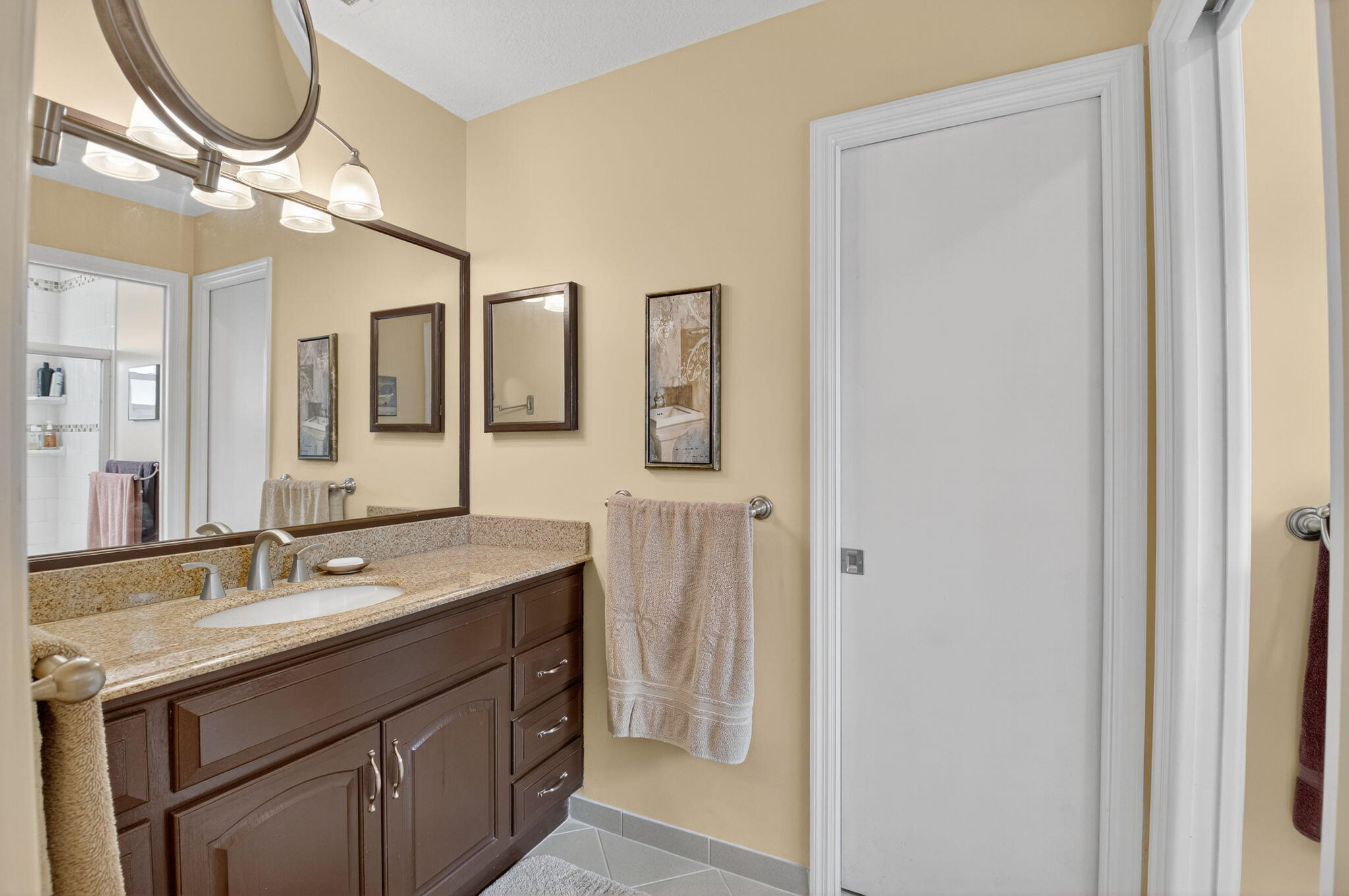17705 Maplewood Drive Boca Raton, FL 33487 - Photo 33 of 71 a bathroom with a sink a vanity and a mirror