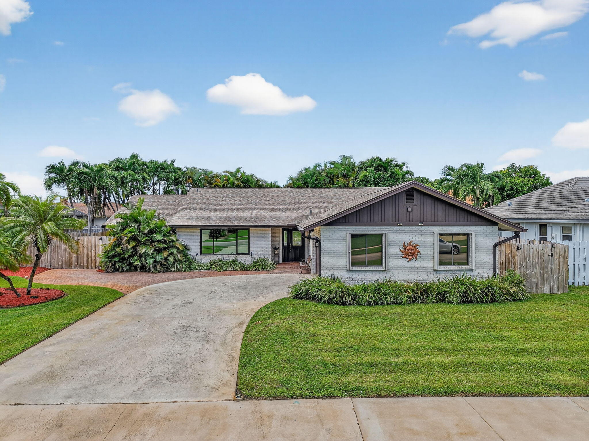 17705 Maplewood Drive Boca Raton, FL 33487 - Photo 47 of 71 a view of a house with a yard and potted plants