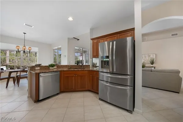 a kitchen with appliances and cabinets