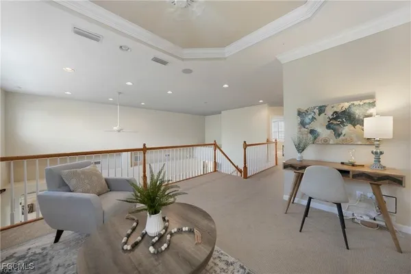 a living room with furniture potted plant and a rug