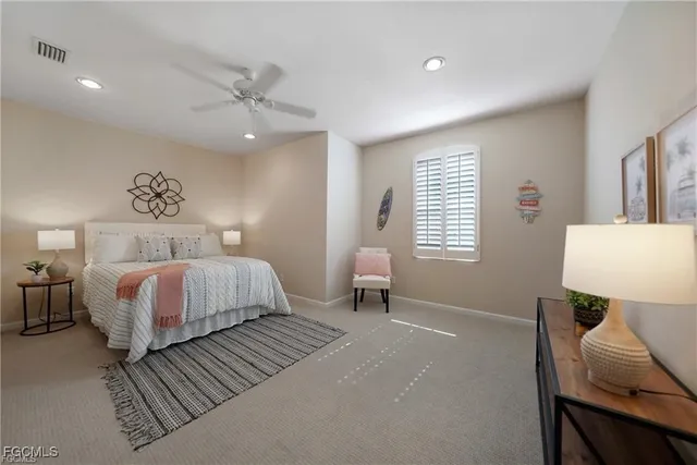 a bedroom with a bed and a chair