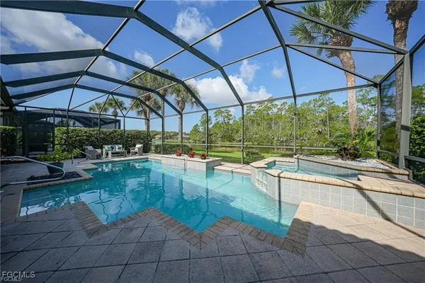 a view of a swimming pool with a patio