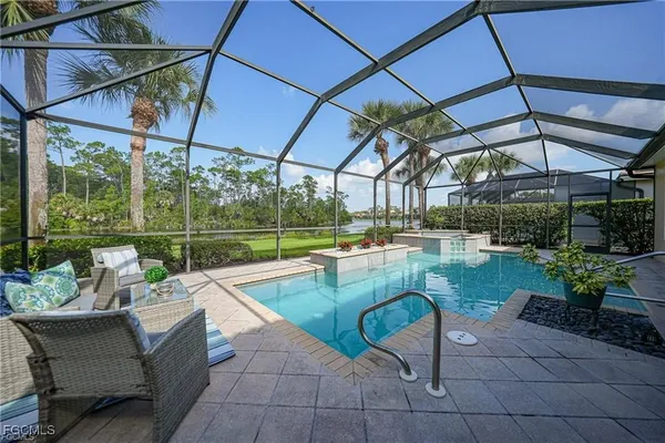 a view of a swimming pool with a patio