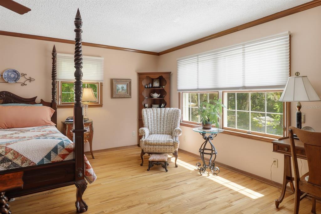 6491 Spruce Creek Road Port Orange, FL 32127 - Photo 19 of 73 a bedroom with furniture and a window