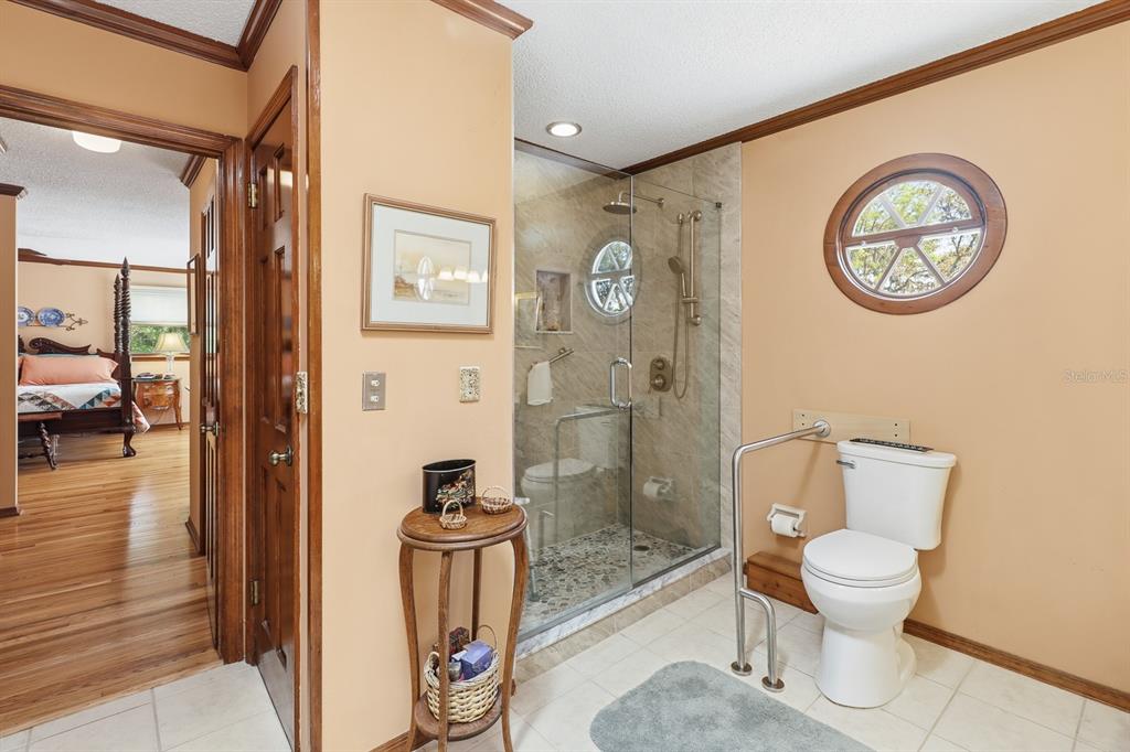 6491 Spruce Creek Road Port Orange, FL 32127 - Photo 22 of 73 a bathroom with a toilet and a shower