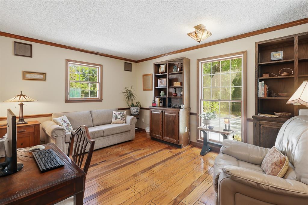 6491 Spruce Creek Road Port Orange, FL 32127 - Photo 29 of 73 a living room with furniture and a window