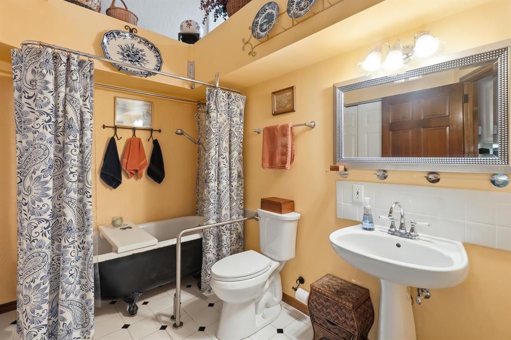 6491 Spruce Creek Road Port Orange, FL 32127 - Photo 32 of 73 a bathroom with a sink toilet and shower