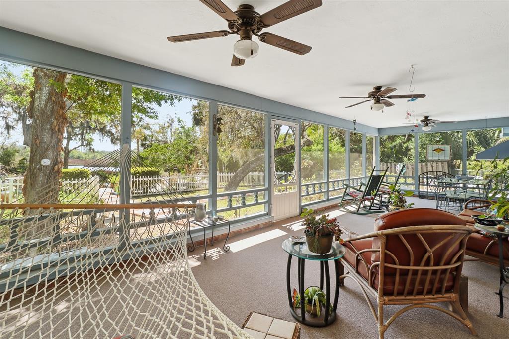 6491 Spruce Creek Road Port Orange, FL 32127 - Photo 35 of 73 a view of a dining room with furniture window and outside view