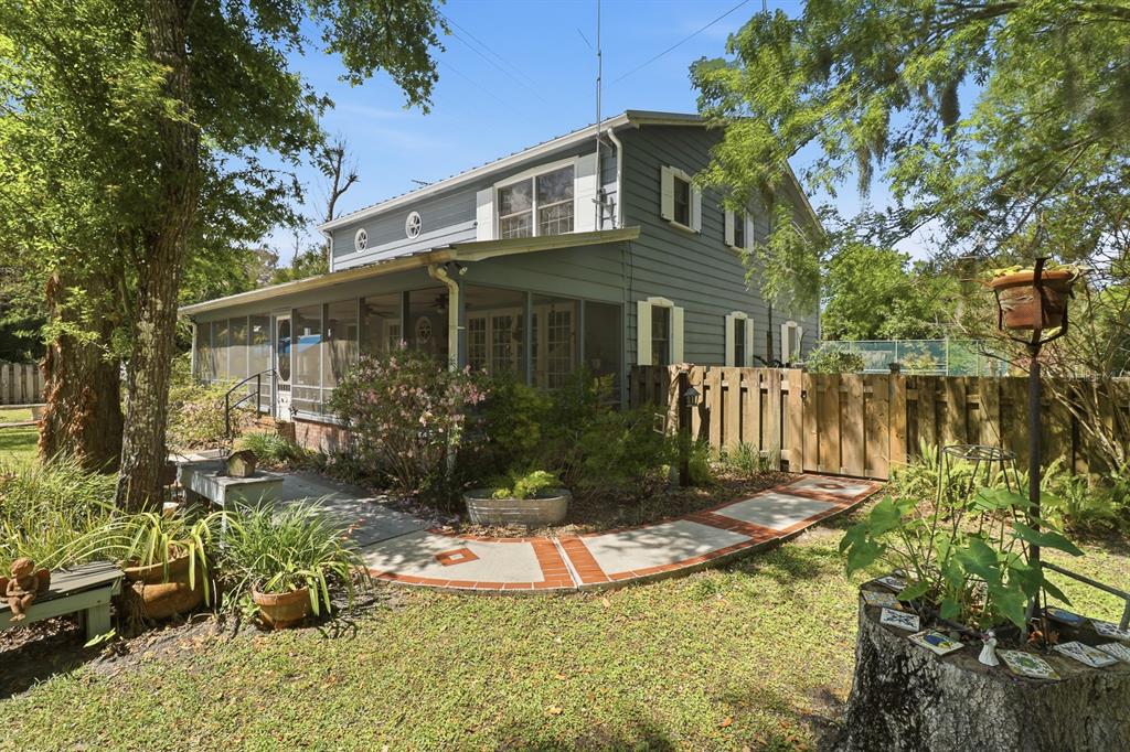 6491 Spruce Creek Road Port Orange, FL 32127 - Photo 37 of 73 a front view of a house with a yard