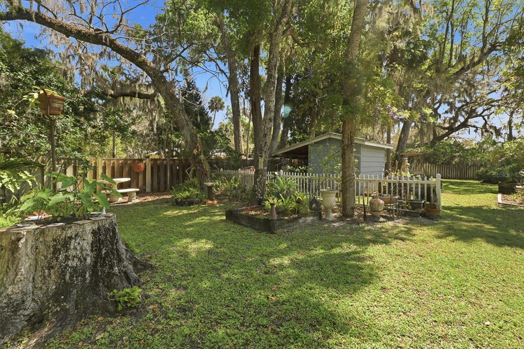 6491 Spruce Creek Road Port Orange, FL 32127 - Photo 45 of 73 a view of a house with a yard