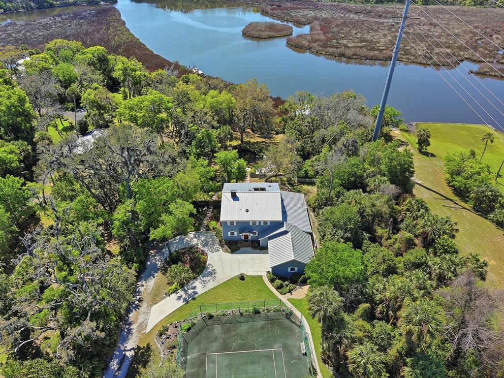 6491 Spruce Creek Road Port Orange, FL 32127 - Photo 58 of 73 an aerial view of a house with a yard