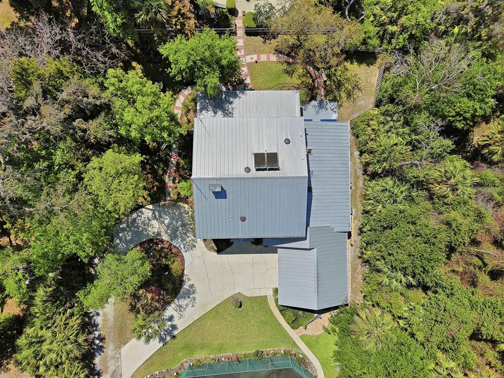 6491 Spruce Creek Road Port Orange, FL 32127 - Photo 64 of 73 an aerial view of residential houses with outdoor space